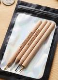 Le Crayon à Gratter artifact cleaning kit for metal detecting finds, featuring four specialized pencils for removing dirt and encrustation from ancient coins without damaging patina